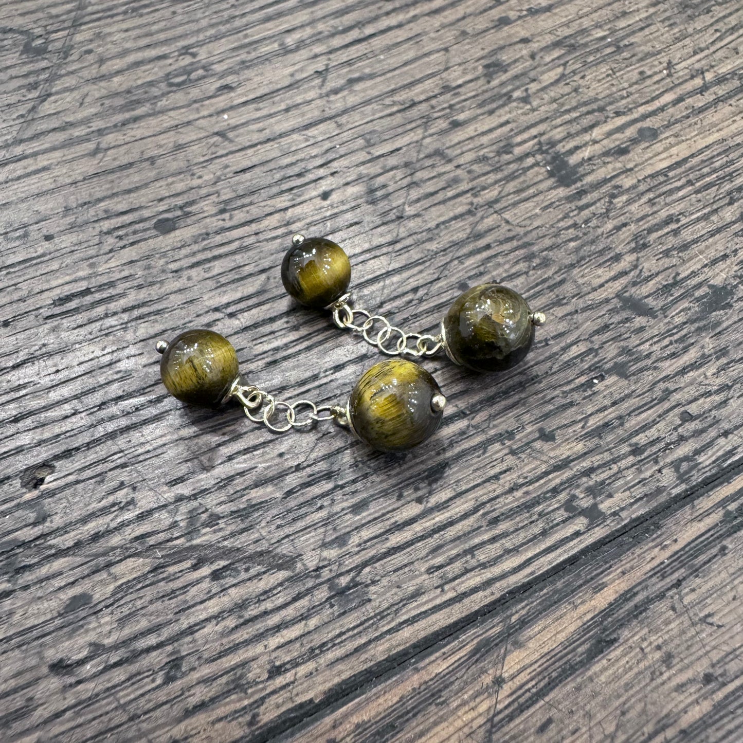 GEMELLI DIVERSI in oro e Occhio di Tigre